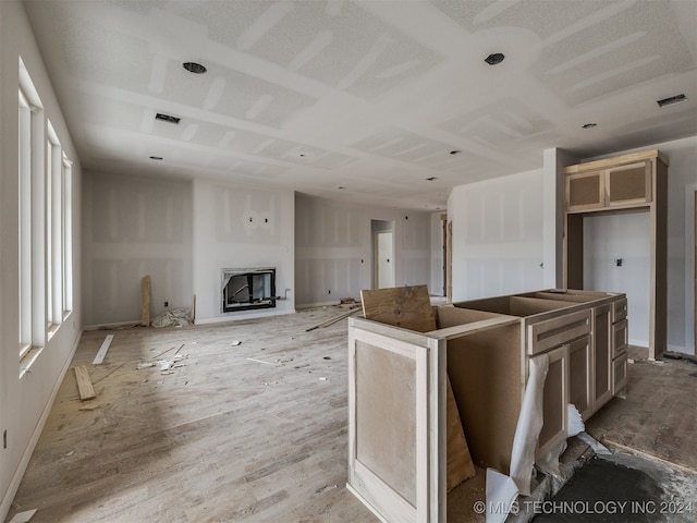 kitchen featuring a center island and light wood-type flooring