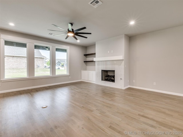 unfurnished living room featuring ceiling fan, baseboards, and visible vents
