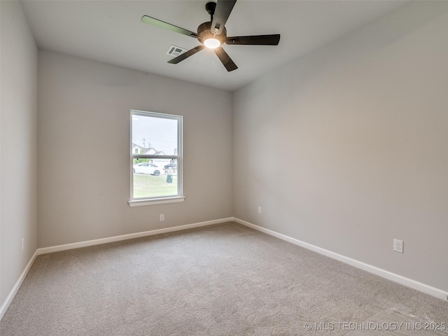 unfurnished room with visible vents, baseboards, a ceiling fan, and carpet flooring