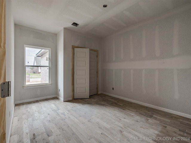 unfurnished bedroom with light hardwood / wood-style flooring