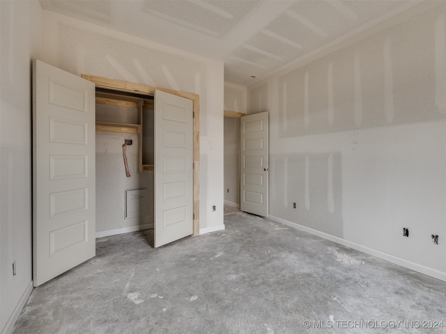 unfurnished bedroom featuring concrete floors