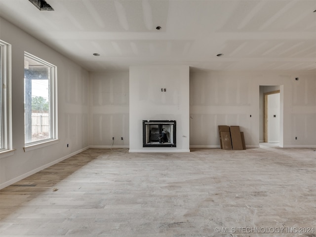 unfurnished living room with light hardwood / wood-style floors