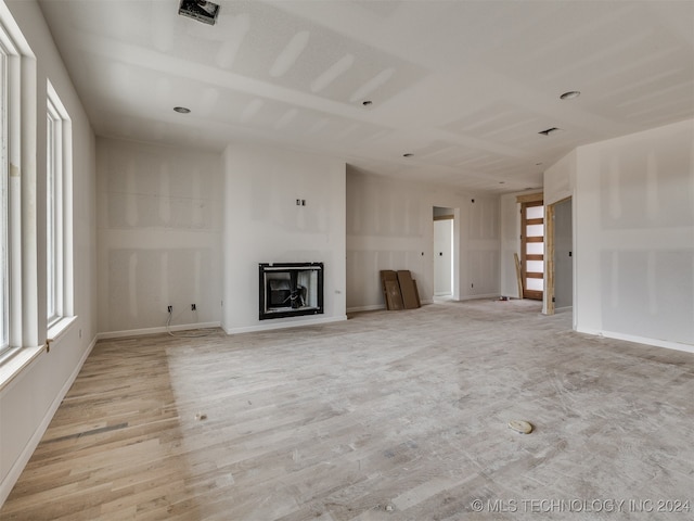 unfurnished living room featuring light hardwood / wood-style floors