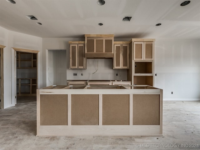 kitchen featuring a center island with sink