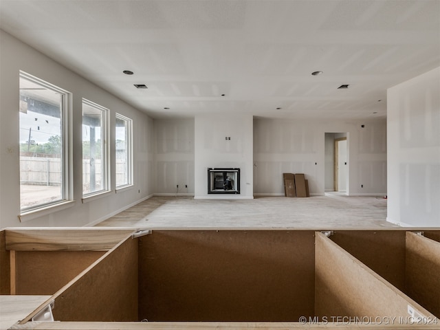 unfurnished living room with hardwood / wood-style flooring