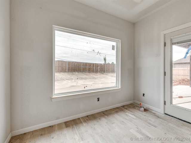 empty room with light hardwood / wood-style floors