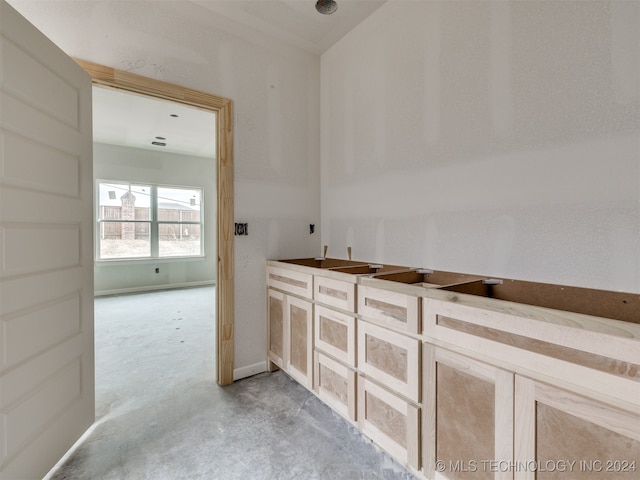 bathroom with concrete flooring