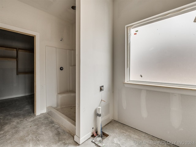 bathroom with concrete flooring