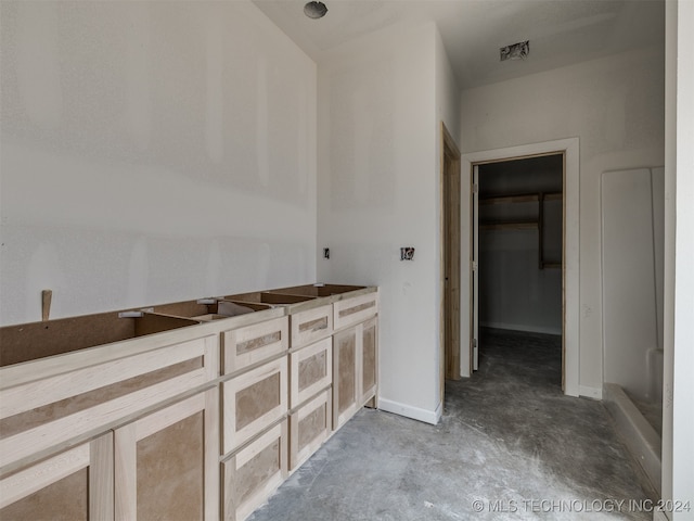 bathroom with concrete floors