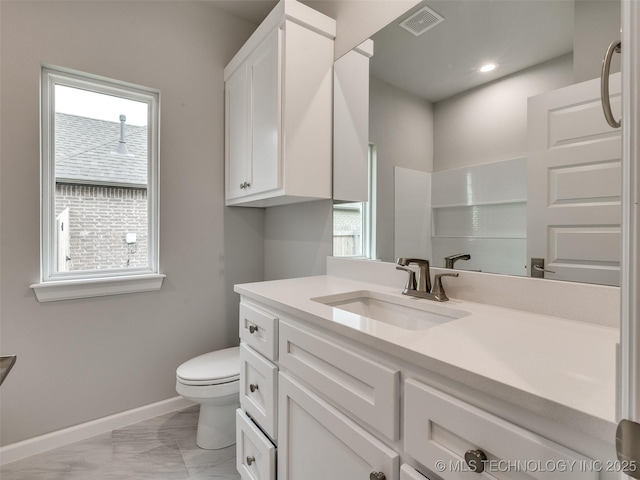 bathroom featuring vanity, marble finish floor, baseboards, toilet, and visible vents