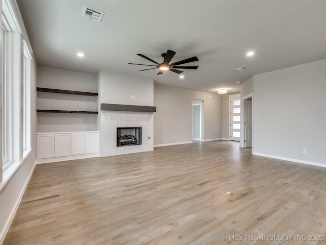 unfurnished living room featuring light wood-style flooring, baseboards, visible vents, recessed lighting, and a ceiling fan