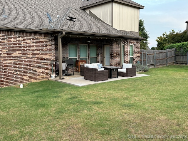 back of house with an outdoor living space, a yard, and a patio