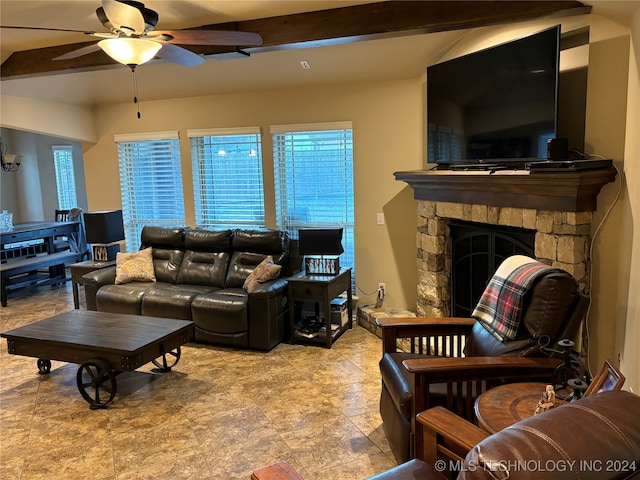 living room featuring a fireplace, beam ceiling, and ceiling fan