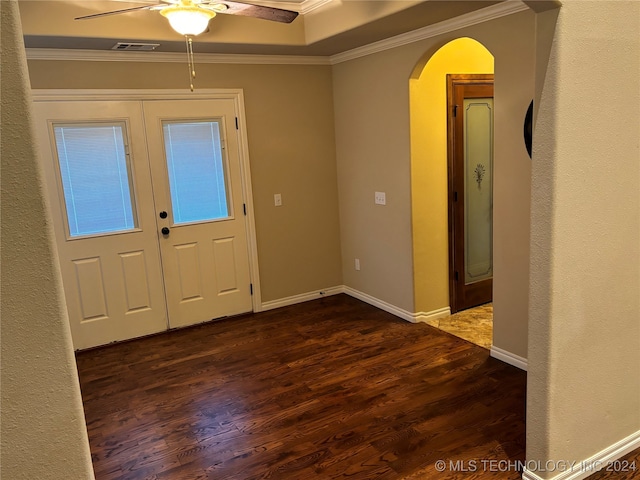 entryway featuring ceiling fan, french doors, dark wood-type flooring, and ornamental molding