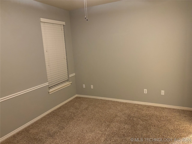 empty room featuring carpet flooring