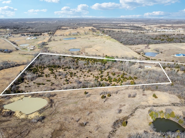 aerial view with a rural view and a water view