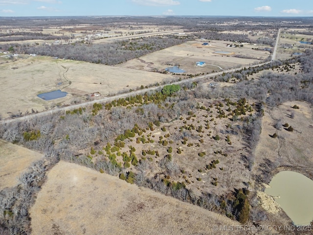 birds eye view of property featuring a rural view