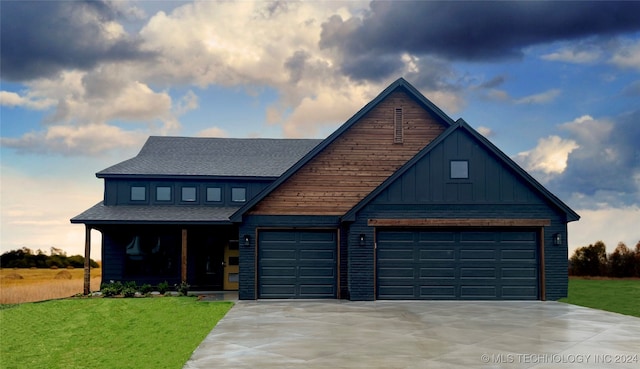 view of front facade featuring driveway, a front lawn, board and batten siding, and roof with shingles