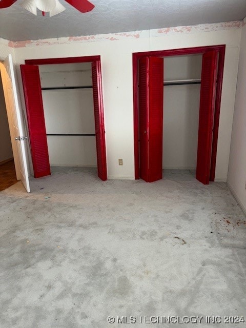 unfurnished bedroom featuring light carpet and ceiling fan