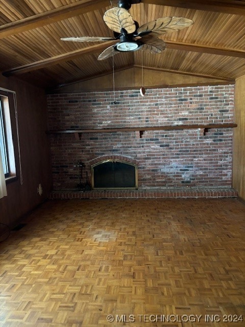 unfurnished living room featuring ceiling fan, brick wall, vaulted ceiling, wooden walls, and light parquet flooring