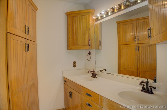 bathroom with vanity and lofted ceiling