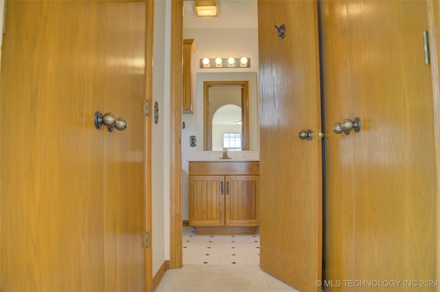 bathroom with vanity and a textured ceiling