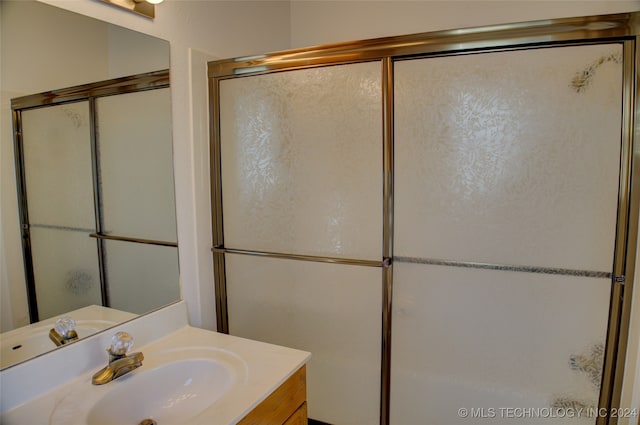 bathroom featuring vanity and walk in shower