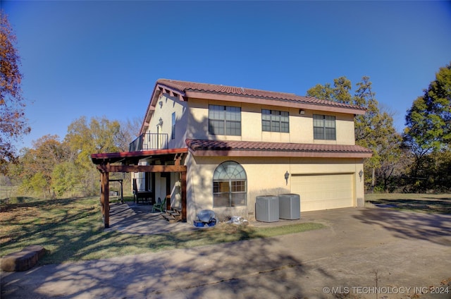 17808 S 129th E Ave, Bixby, OK 74008 - view of front of house with a garage, a tile roof, stucco siding, and driveway