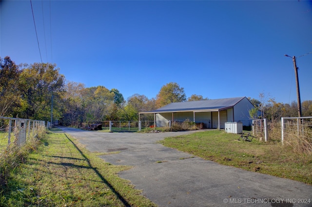 17808 S 129th E Ave, Bixby, OK 74008 - view of asphalt driveway with street lighting