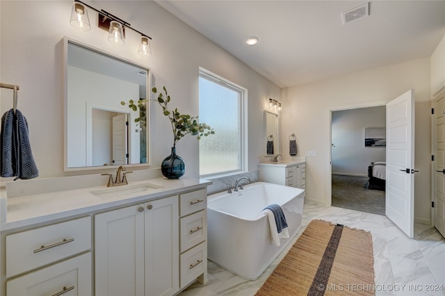 bathroom featuring a bathing tub and vanity