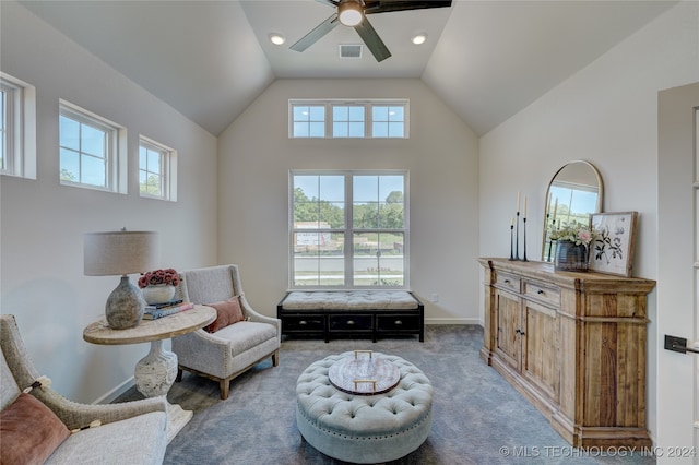 living area featuring carpet, high vaulted ceiling, and ceiling fan