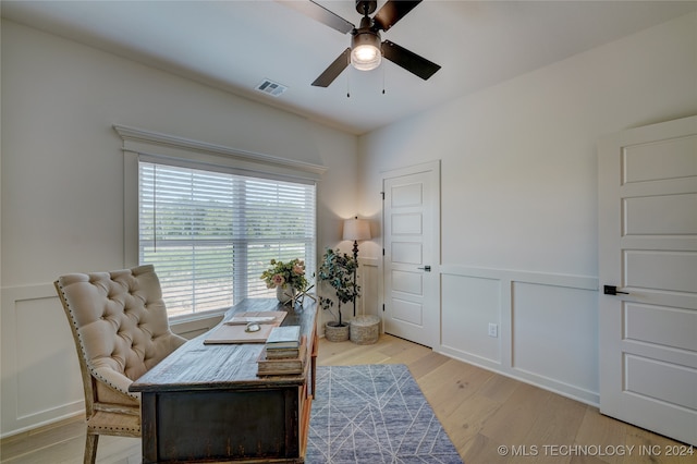 office with ceiling fan and light hardwood / wood-style floors