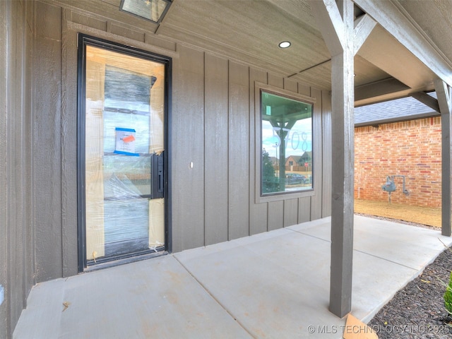 doorway to property featuring a patio area