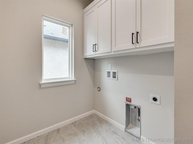 laundry area with cabinets, a wealth of natural light, hookup for a washing machine, and electric dryer hookup