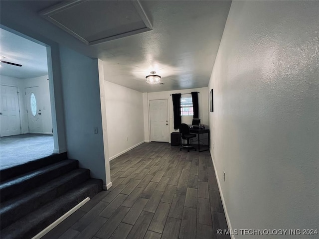 corridor featuring dark wood-type flooring