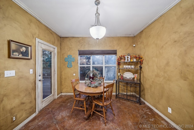 dining room featuring crown molding