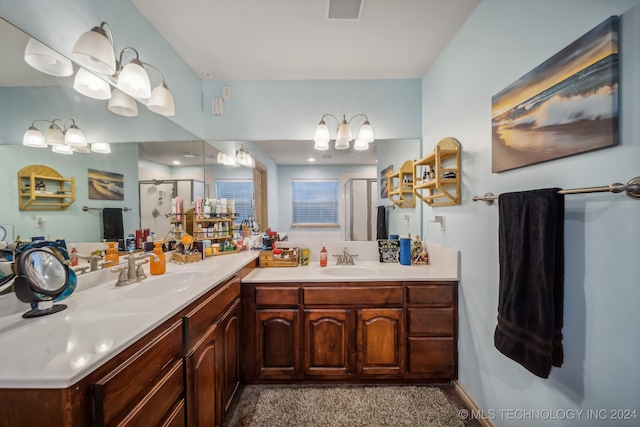 bathroom featuring vanity and a shower with shower door