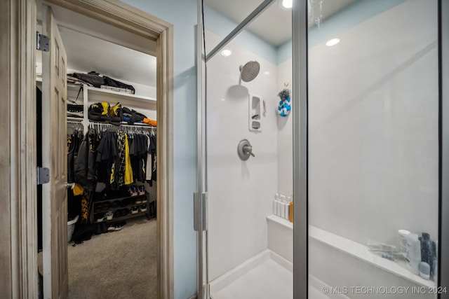 bathroom with a shower with shower door