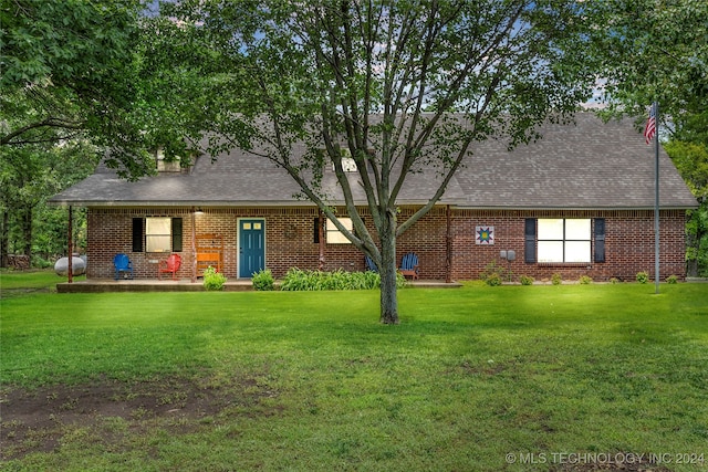 view of front of home with a front yard