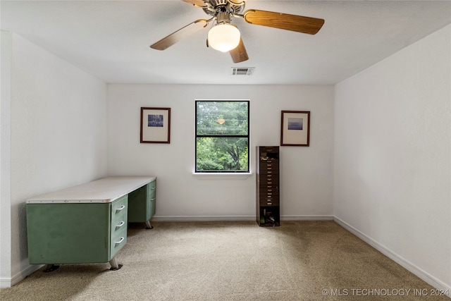 unfurnished office with light carpet and ceiling fan