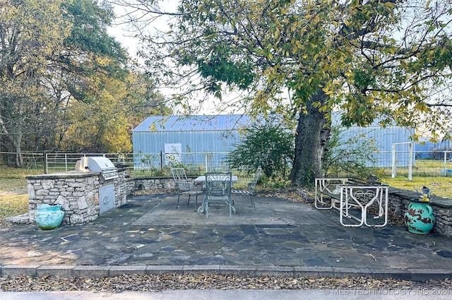 view of patio / terrace with an outdoor kitchen and grilling area