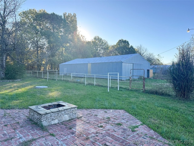 view of yard with a patio area and a fire pit