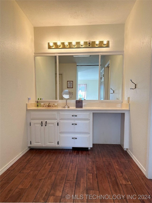 bathroom with vanity and wood-type flooring