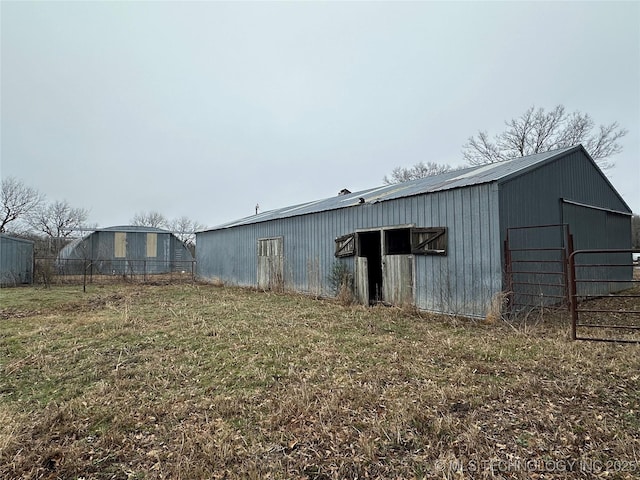 view of outbuilding with a yard