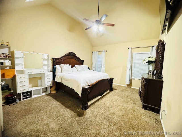 carpeted bedroom with ceiling fan and high vaulted ceiling