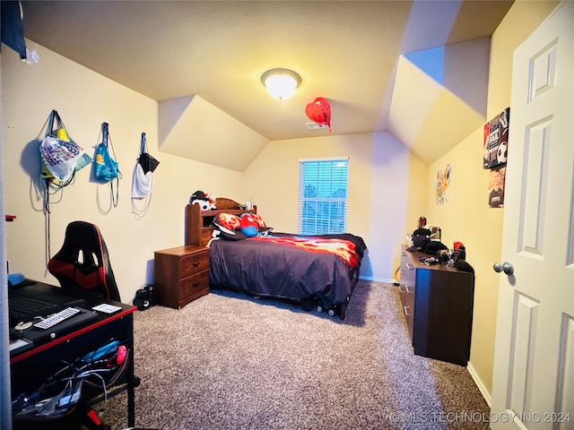 bedroom with carpet flooring and vaulted ceiling