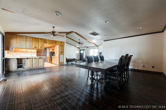 dining space with lofted ceiling with beams, dark hardwood / wood-style floors, crown molding, and a textured ceiling