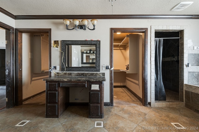 bathroom with curtained shower, ornamental molding, and a textured ceiling