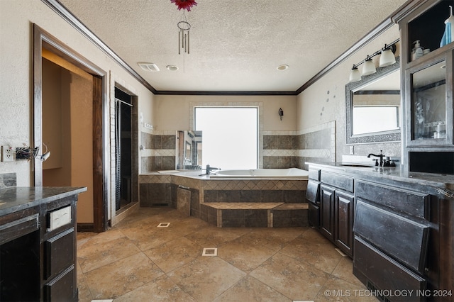 bathroom with vanity, ornamental molding, and a textured ceiling