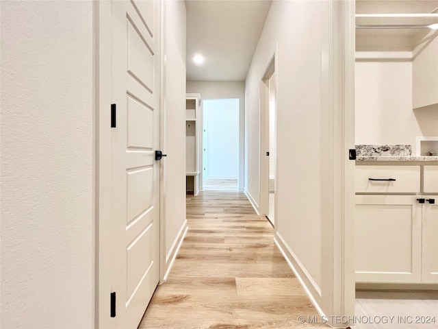 hallway with light wood-type flooring